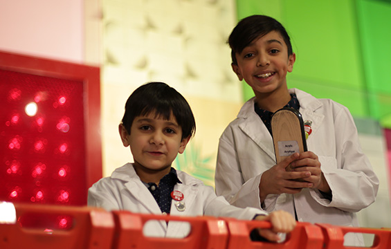 Two boys experiment with friction at the Science Centre.