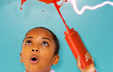 A child squirting ketchup in the air.