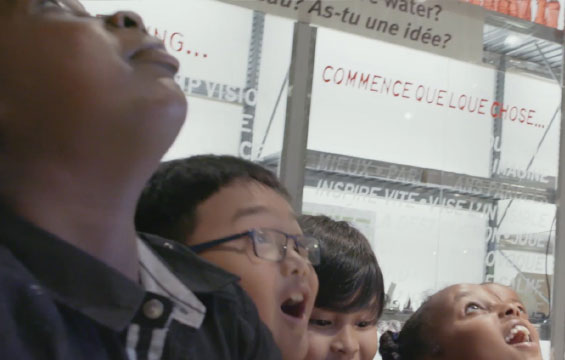 Children look up in wonder at the Ontario Science Centre.