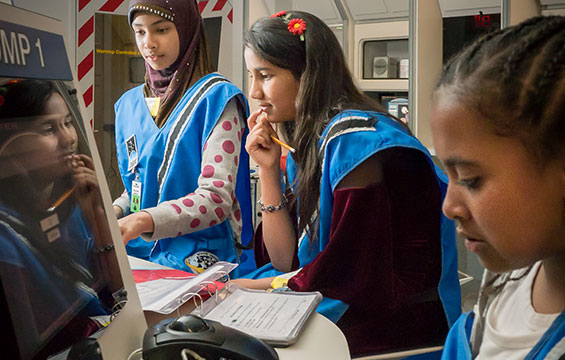 Students work to solve a problem in the Challenger Learning Centre.