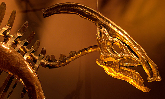 A large metal dinosaur sculpture.