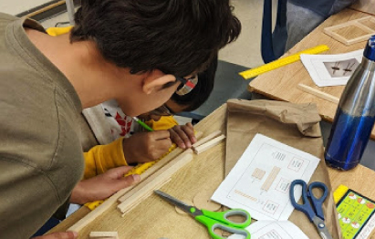 Two students designing and building an engineering project.