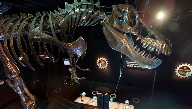 A screenshot of the virtual tour featuring a large metal sculpture of a dinosaur.