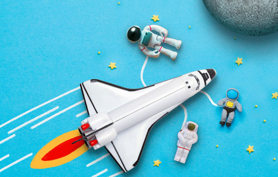 A toy space shuttle and astronauts.