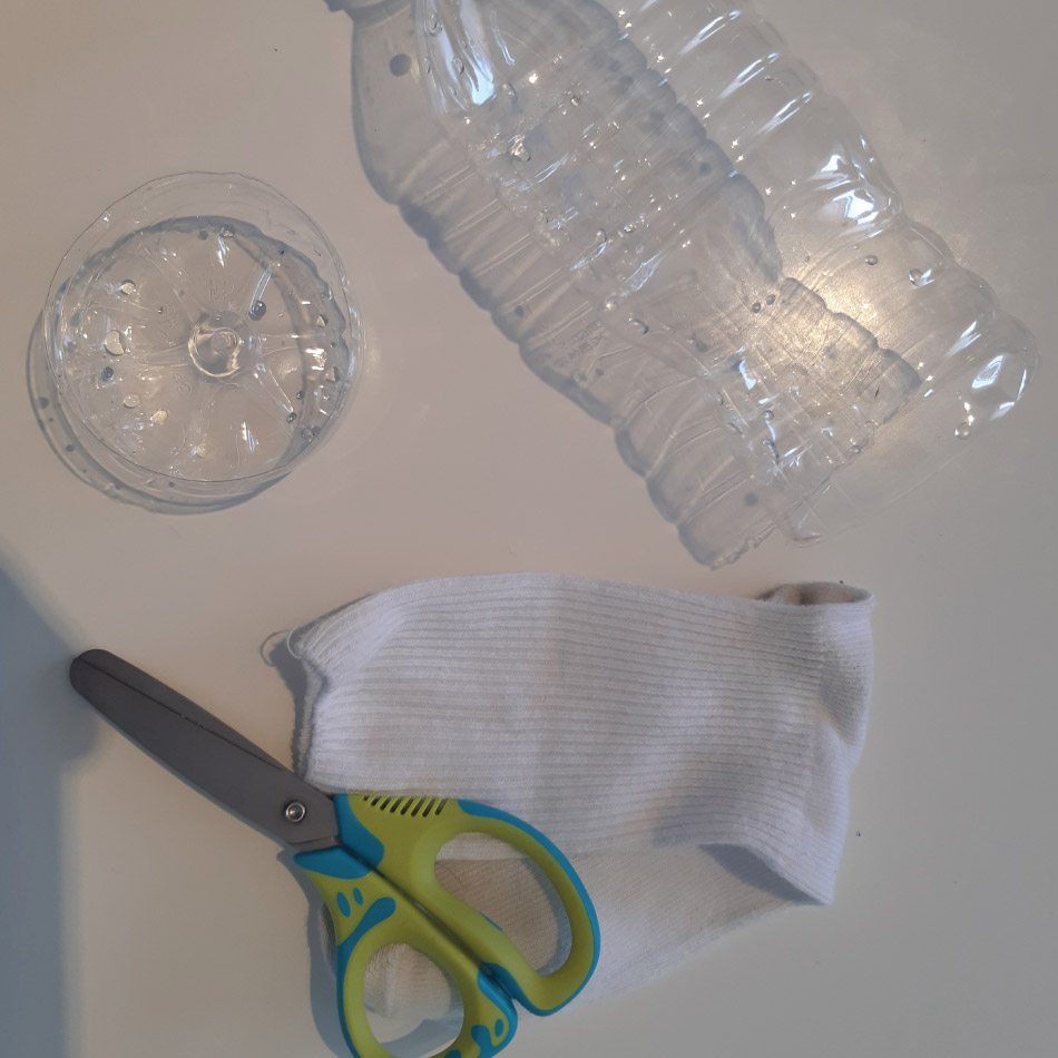Material required for this activity, including a pair of scissors, a sock, and an empty plastic bottle.