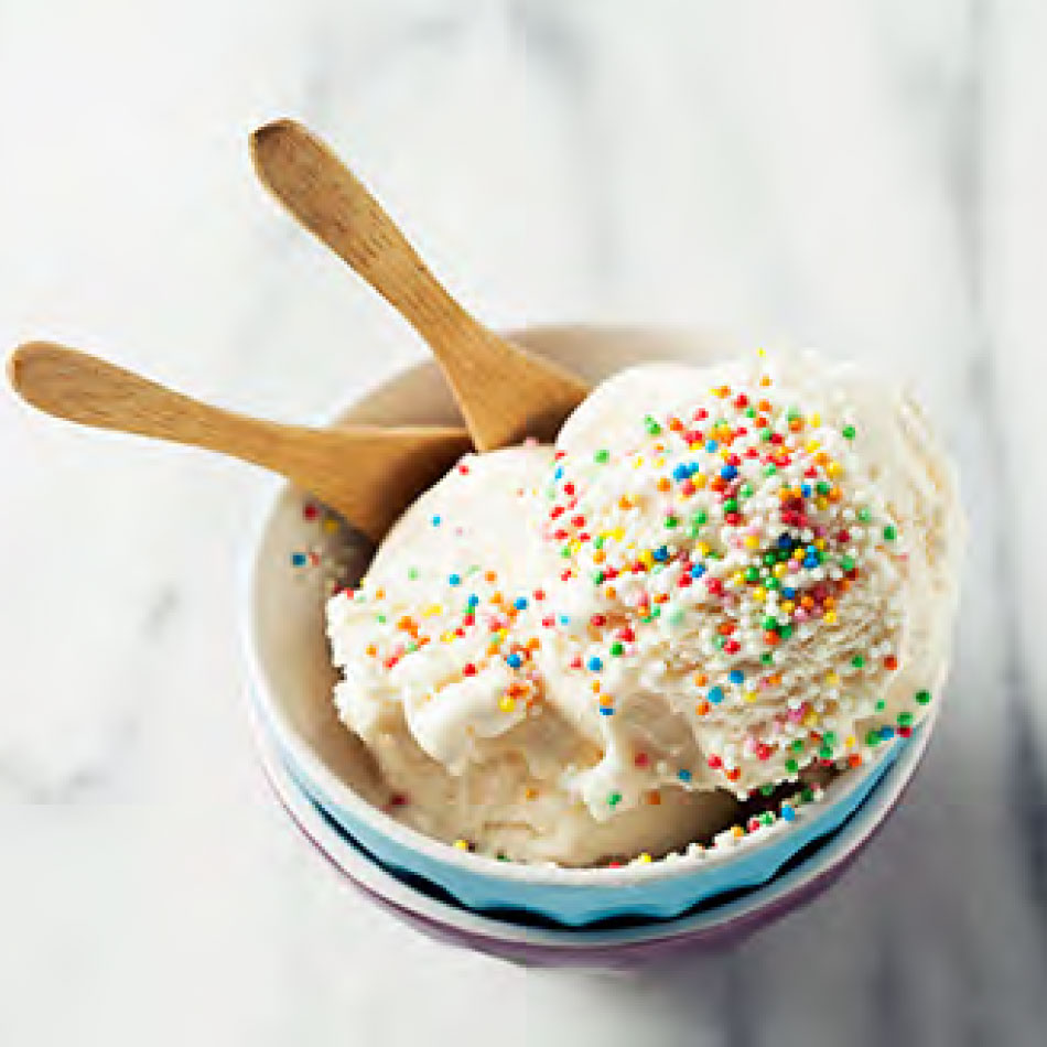 A bowl of ice cream with sprinkles.