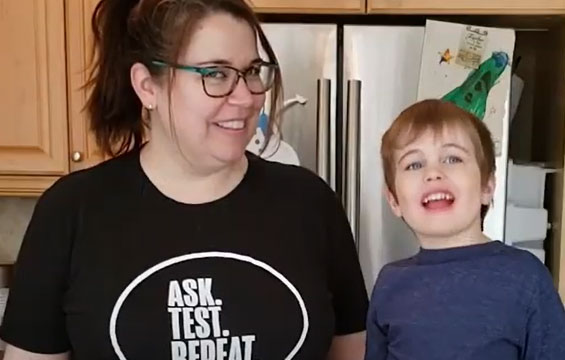 A smiling woman and child.