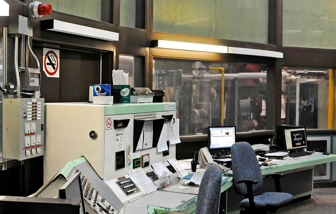 A control room with machinery and computers.