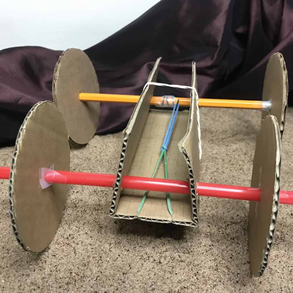 Front view of a completed cardboard rover.