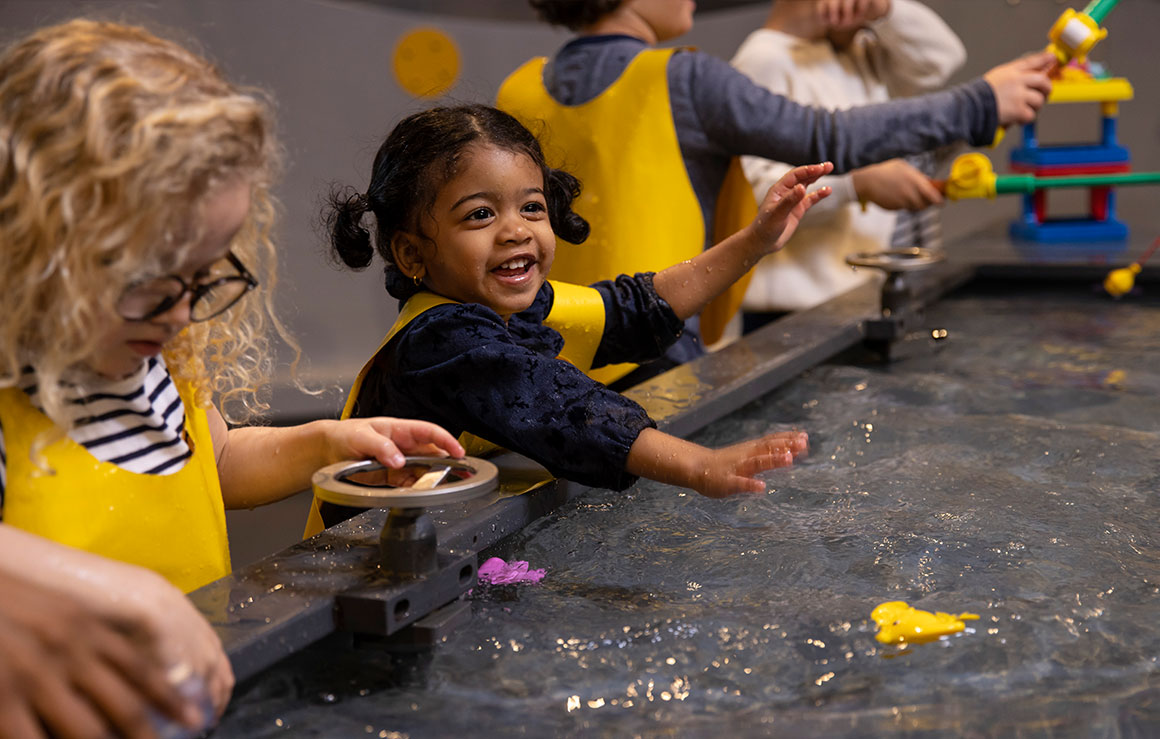 Children playing at a water table.