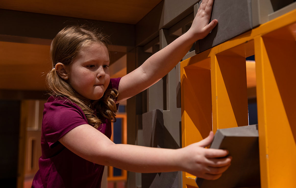 A girl playing in KidSpark.