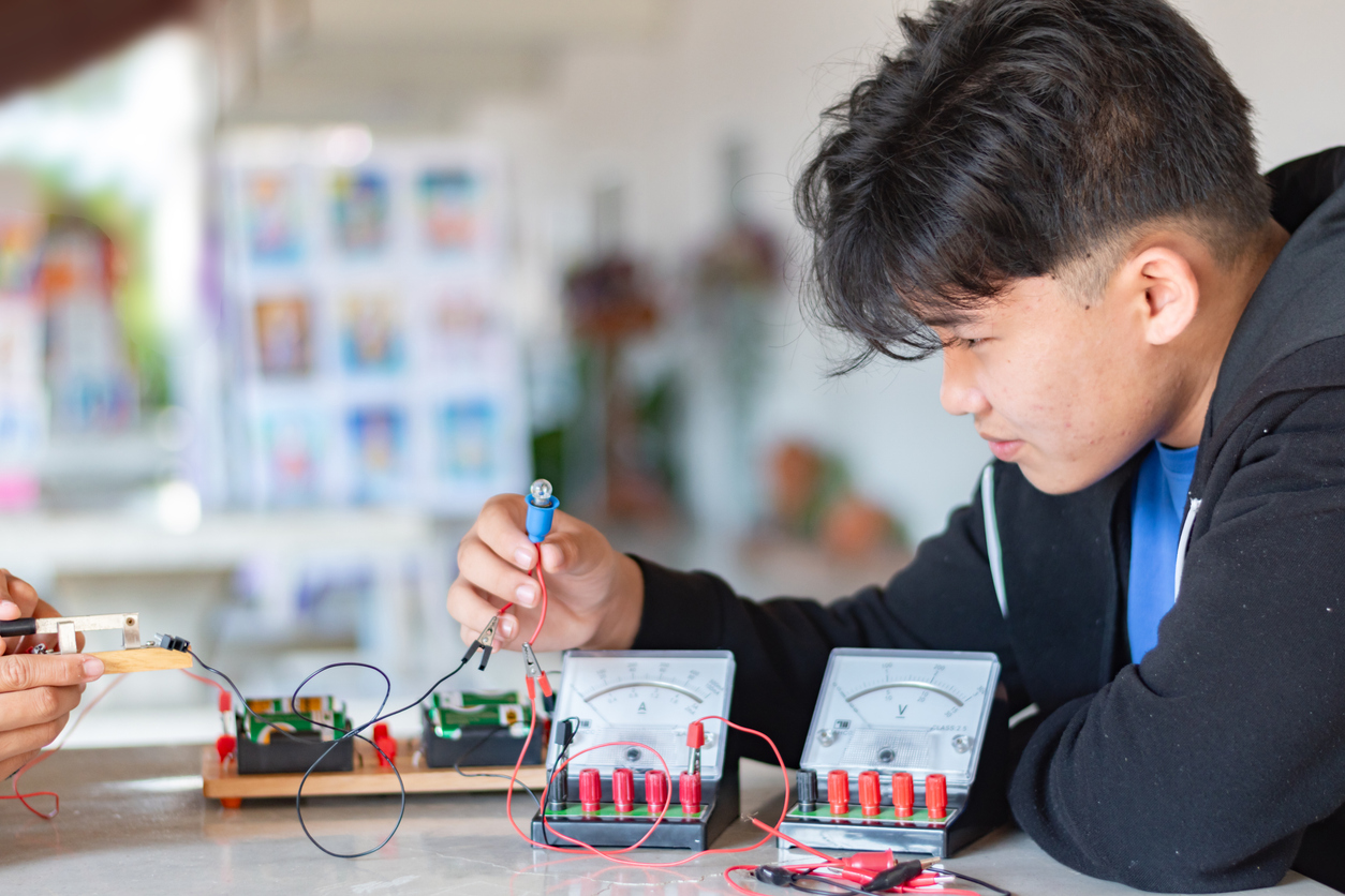 High school student exploring circuits.
