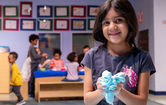 A girl playing with homemade slime.