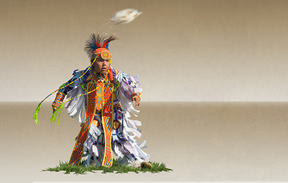 A boy in full regalia.
