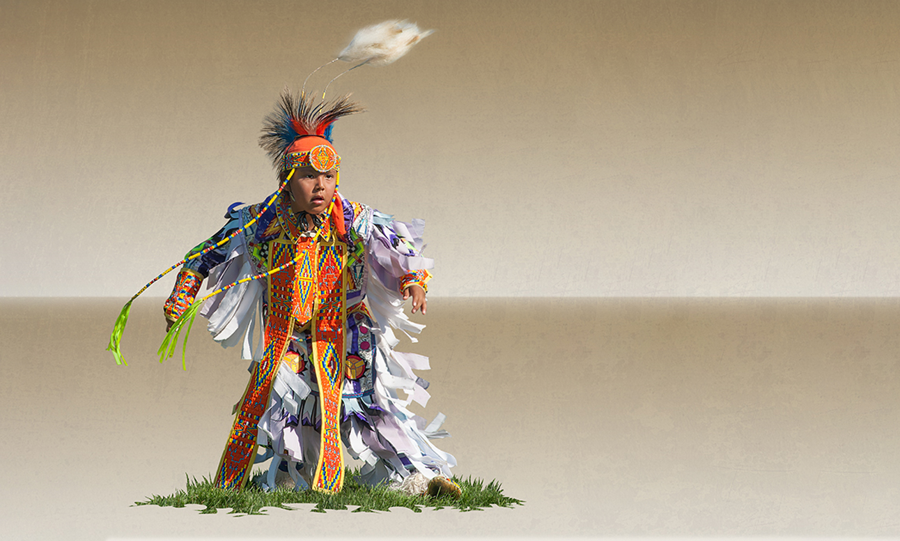 A boy in full regalia.