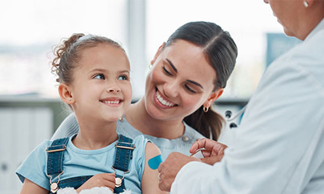 A girl receives a vaccination.