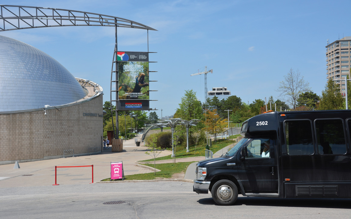Front shuttle bus stop, located near the IBM School & Tour Group Entrance and the OMNIMAX Theatre.