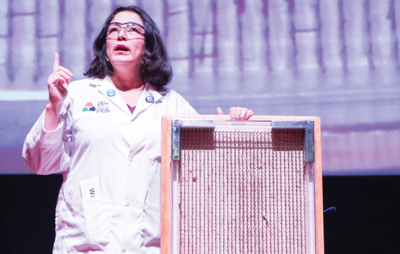 An educator presents a bed of nails.