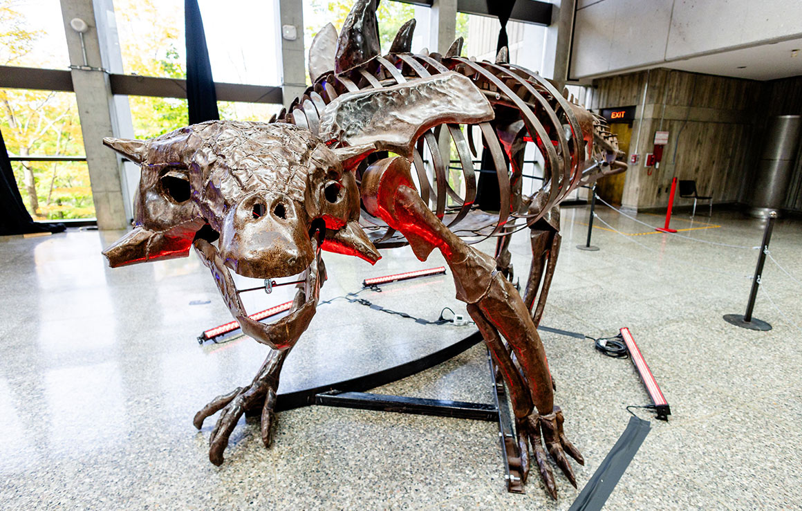A metal dinosaur sculpture.