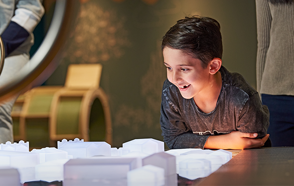 A boy plays in the Earth Matters exhibit.
