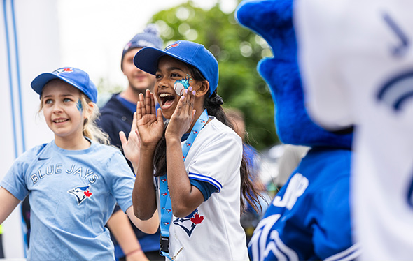Two girls in Bluejays merchandise look excited.