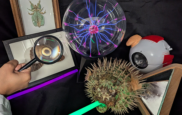 Ball of electricity and a magnifying glass.