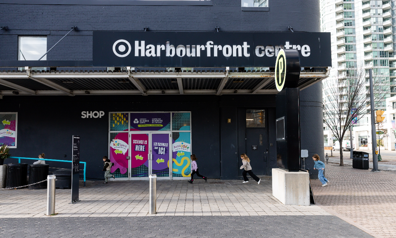 Kids running across the entrance of Harbourfront Centre.